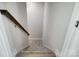 Carpeted staircase with dark wood handrail at 5027 Mclaughlin Loop # 61, Waxhaw, NC 28173