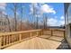 Wooden back deck overlooking wooded scenery with clear blue skies at 5031 Mclaughlin Loop # 60, Waxhaw, NC 28173