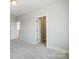 Spacious bedroom with a walk-in closet and neutral carpet flooring at 5031 Mclaughlin Loop # 60, Waxhaw, NC 28173