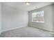 Neutral bedroom features carpet flooring and a bright window with a backyard view at 5031 Mclaughlin Loop # 60, Waxhaw, NC 28173