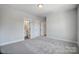 Bedroom featuring neutral-colored carpet, an ensuite bathroom, and natural light at 5031 Mclaughlin Loop # 60, Waxhaw, NC 28173