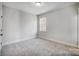Minimalist bedroom design with neutral carpet, window, and modern trim at 5031 Mclaughlin Loop # 60, Waxhaw, NC 28173