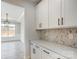 Elegant dining room with wainscoting, a stylish chandelier and ample natural light at 5031 Mclaughlin Loop # 60, Waxhaw, NC 28173