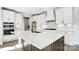 Beautiful kitchen island with white countertops, neutral colored cabinets, and a modern faucet at 5031 Mclaughlin Loop # 60, Waxhaw, NC 28173