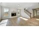 Bright living room featuring recessed lighting, hardwood floors, a fireplace, and an open staircase at 5031 Mclaughlin Loop # 60, Waxhaw, NC 28173