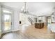 Open concept space that connects the living area with the fireplace and stairs to a well-appointed kitchen at 5031 Mclaughlin Loop # 60, Waxhaw, NC 28173