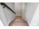 Wooden staircase leading downstairs with a dark wood railing at 5031 Mclaughlin Loop # 60, Waxhaw, NC 28173