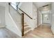 Bright foyer features a staircase with wooden treads and a white railing, leading to the upper level at 5031 Mclaughlin Loop # 60, Waxhaw, NC 28173