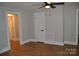 This is a spacious bedroom featuring a ceiling fan and ample natural light, perfect for relaxation and comfort at 510 Belmont Mount Holly Rd, Belmont, NC 28012