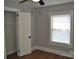 This is a bright bedroom featuring a closet, a ceiling fan, and a window, perfect for relaxation and organization at 510 Belmont Mount Holly Rd, Belmont, NC 28012