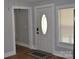 This is a welcoming entryway featuring a stylish front door with decorative glass and a cozy mat for added comfort at 510 Belmont Mount Holly Rd, Belmont, NC 28012