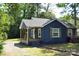 Charming blue home featuring a covered porch with wooden columns and shutters at 510 Belmont Mount Holly Rd, Belmont, NC 28012