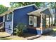 Charming blue home featuring a covered porch with wooden columns, showing address at 510 Belmont Mount Holly Rd, Belmont, NC 28012