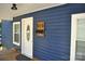Charming blue house featuring a front door, mailbox, address number, and white trim at 510 Belmont Mount Holly Rd, Belmont, NC 28012