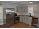 Modern kitchen featuring stainless steel appliances, butcher block countertops, and wood floors at 510 Belmont Mount Holly Rd, Belmont, NC 28012