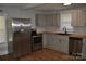 Modern kitchen featuring stainless steel appliances, butcher block countertops, and wood floors at 510 Belmont Mount Holly Rd, Belmont, NC 28012