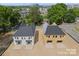 Aerial view of two new construction duplexes with unfinished exteriors and garages at 511 Bowman Rd, Charlotte, NC 28217