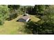 Aerial shot shows a large property featuring a home, a detached garage, and an expansive green lawn at 567 Willie Ln, York, SC 29745