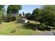 Aerial view of a house with a detached garage on a sprawling green lawn at 567 Willie Ln, York, SC 29745