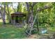 Picturesque backyard featuring a classic gazebo and rustic wooden swing set, perfect for outdoor relaxation and play at 567 Willie Ln, York, SC 29745