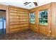 Bonus room with built-in shelving, wood paneling, tile floors, and multiple windows with natural light at 567 Willie Ln, York, SC 29745