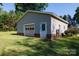 A detached garage with a roll-up door and side entry, providing extra storage or workspace at 567 Willie Ln, York, SC 29745
