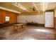 Spacious garage interior with workbenches and pegboard, ideal for projects and organization at 567 Willie Ln, York, SC 29745