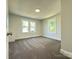 Bedroom featuring new carpet, white paint and trim, and plenty of natural light at 589 Fork Rd, Norwood, NC 28128
