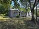 Charming single-Gathering home with gray siding and a brick chimney at 589 Fork Rd, Norwood, NC 28128