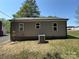 Exterior view showcasing the well-maintained siding and the home's functional air conditioning unit at 589 Fork Rd, Norwood, NC 28128