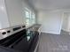 Close view of the kitchen featuring stainless steel oven and updated countertop at 589 Fork Rd, Norwood, NC 28128