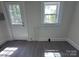 Sun-filled room featuring gray floors, fresh paint, and a bright window to the outside at 589 Fork Rd, Norwood, NC 28128