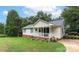 Charming single-story home with a welcoming front porch, well-maintained lawn, and mature trees at 592 Rambo E Rd, Rock Hill, SC 29730