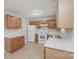 Efficient kitchen with white appliances, laminate countertops, light wood cabinets and vinyl floors at 592 Rambo E Rd, Rock Hill, SC 29730