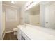 Bathroom view showcasing a long vanity with cabinets, toilet, window and large mirror at 721 Summerwood Dr, Rock Hill, SC 29732