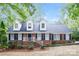 Charming brick home featuring classic dormers and a welcoming white-railed porch at 721 Summerwood Dr, Rock Hill, SC 29732