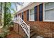 A close up of the brick work on a charming home with white trim and black shutters at 721 Summerwood Dr, Rock Hill, SC 29732