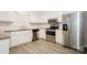 Modern kitchen with stainless steel appliances, light cabinets, and granite countertops at 721 Summerwood Dr, Rock Hill, SC 29732