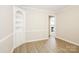 Bright living room features fresh paint, wood trim, built-in shelves and laminate flooring at 721 Summerwood Dr, Rock Hill, SC 29732