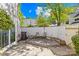 Enclosed back yard featuring mature landscaping and outdoor seating area at 7407 Mystic Ln, Charlotte, NC 28227