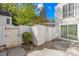 Enclosed back yard area with fencing, a small storage shed and sliding door access at 7407 Mystic Ln, Charlotte, NC 28227