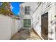 Enclosed back yard area with sliding door access to the home's interior at 7407 Mystic Ln, Charlotte, NC 28227