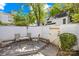Cozy fenced backyard with patio, table, and chairs, perfect for outdoor relaxation at 7407 Mystic Ln, Charlotte, NC 28227