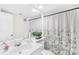 Bathroom featuring a white vanity, large mirror, and shower with decorative curtain at 7407 Mystic Ln, Charlotte, NC 28227