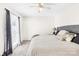 Bedroom with neutral walls, ceiling fan, and natural light from the window at 7407 Mystic Ln, Charlotte, NC 28227