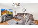 Cozy living room with a large sectional sofa, TV, and electric fireplace insert at 7407 Mystic Ln, Charlotte, NC 28227