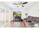 Living room featuring a plush sectional sofa, modern entertainment center and sliding glass door at 7407 Mystic Ln, Charlotte, NC 28227