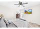 Main bedroom featuring soft natural light, a ceiling fan, a dresser and neutral décor at 7407 Mystic Ln, Charlotte, NC 28227