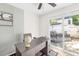 Office space features a modern desk and sliding door access to a backyard patio at 7407 Mystic Ln, Charlotte, NC 28227