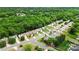 Aerial shot of a residential area with lush trees surrounding a neighborhood and its streets at 8800 Darcy Hopkins Dr, Charlotte, NC 28277